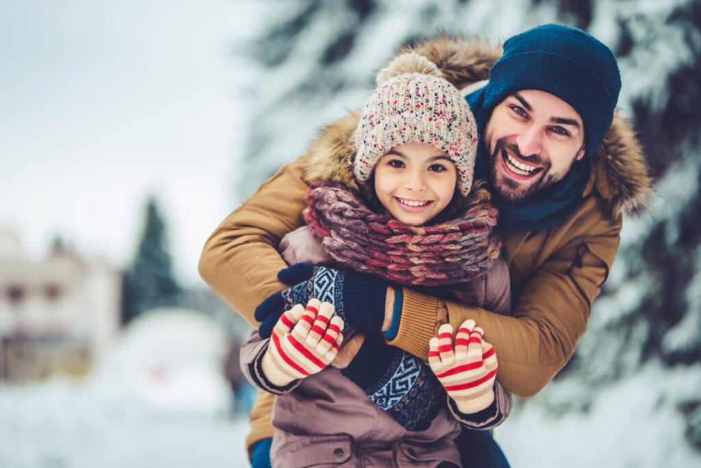 Dad with daughter outdoor in winter